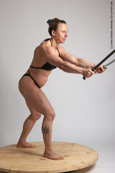 Swimsuit Fighting with knife Woman White Standing poses - ALL Muscular medium brown Standing poses - simple Academic