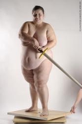 Nude Fighting with sword Woman White Standing poses - ALL Overweight medium brown Standing poses - simple Pinup