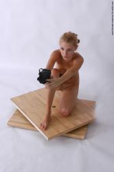 Nude Fighting with gun Woman White Kneeling poses - ALL Slim Kneeling poses - on one knee long blond Pinup