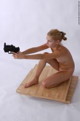 Nude Fighting with gun Woman White Kneeling poses - ALL Slim Kneeling poses - on one knee long blond Pinup
