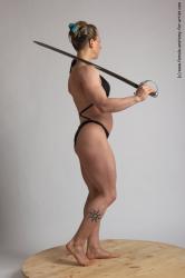 Swimsuit Fighting with sword Woman White Standing poses - ALL Muscular medium brown Standing poses - simple Academic